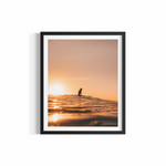 Surfer silhouetted against golden sunset at Wategos Beach — Golden Memories ocean photography print by Saxon Kent
