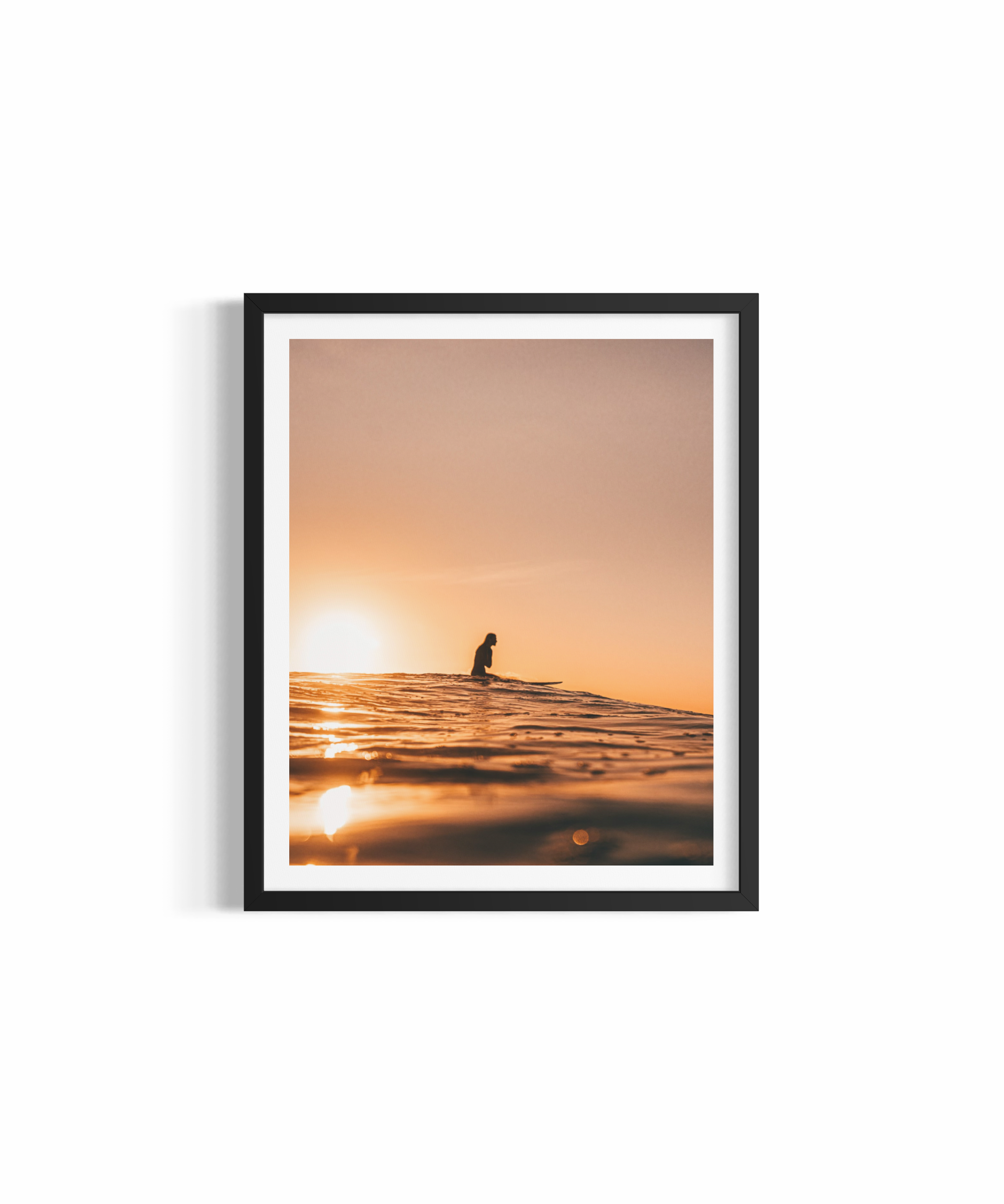 Surfer silhouetted against golden sunset at Wategos Beach — Golden Memories ocean photography print by Saxon Kent