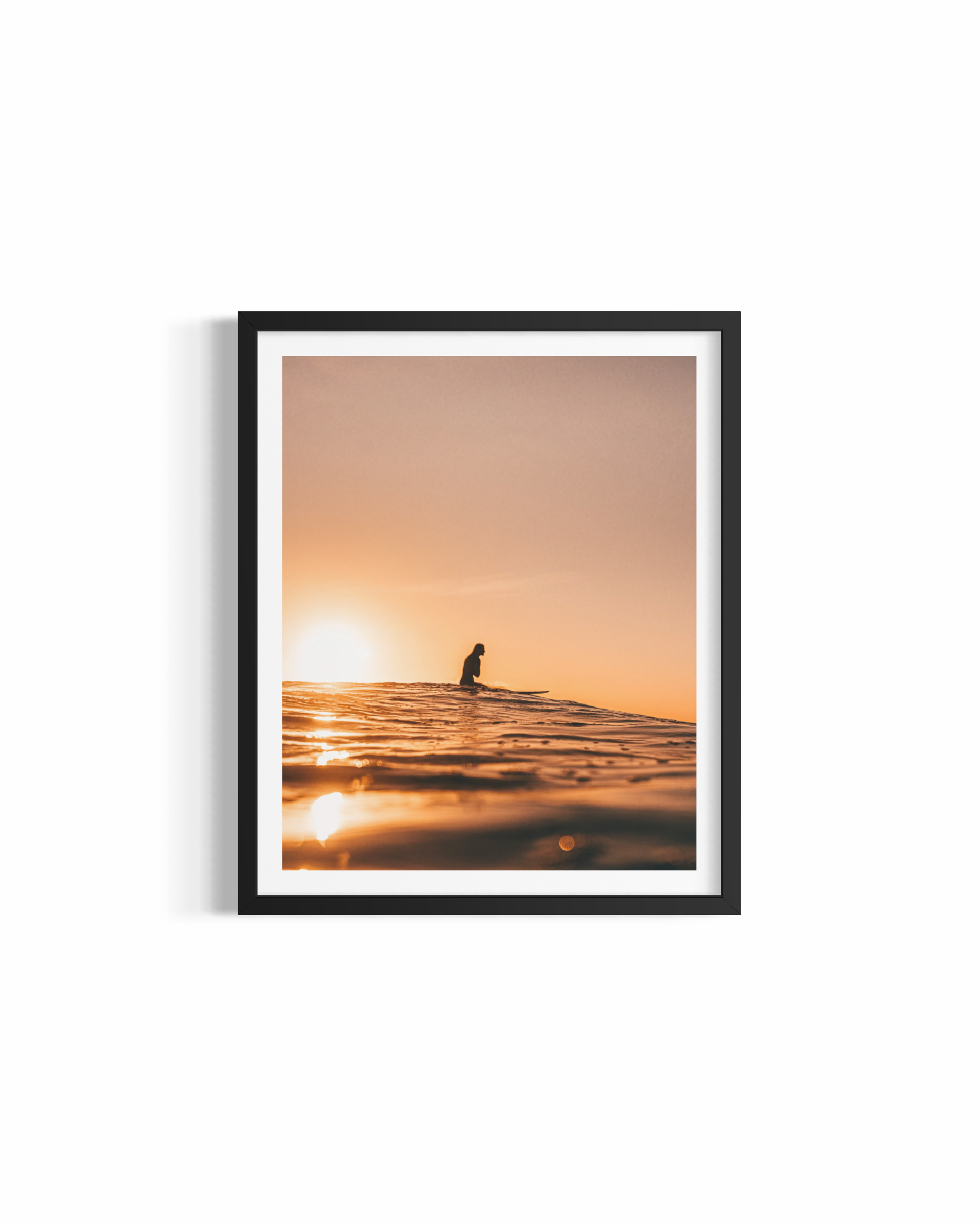Surfer silhouetted against golden sunset at Wategos Beach — Golden Memories ocean photography print by Saxon Kent