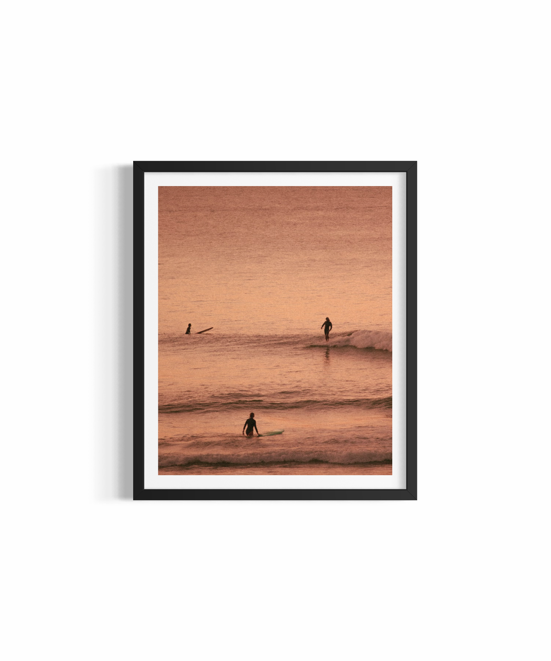 Three surfers silhouetted at golden hour at The Pass Byron Bay — Different Perspectives fine art print by Saxon Kent