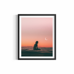 Surfer silhouetted beneath crescent moon at twilight at The Pass Byron Bay — Eclipse fine art print by Saxon Kent
