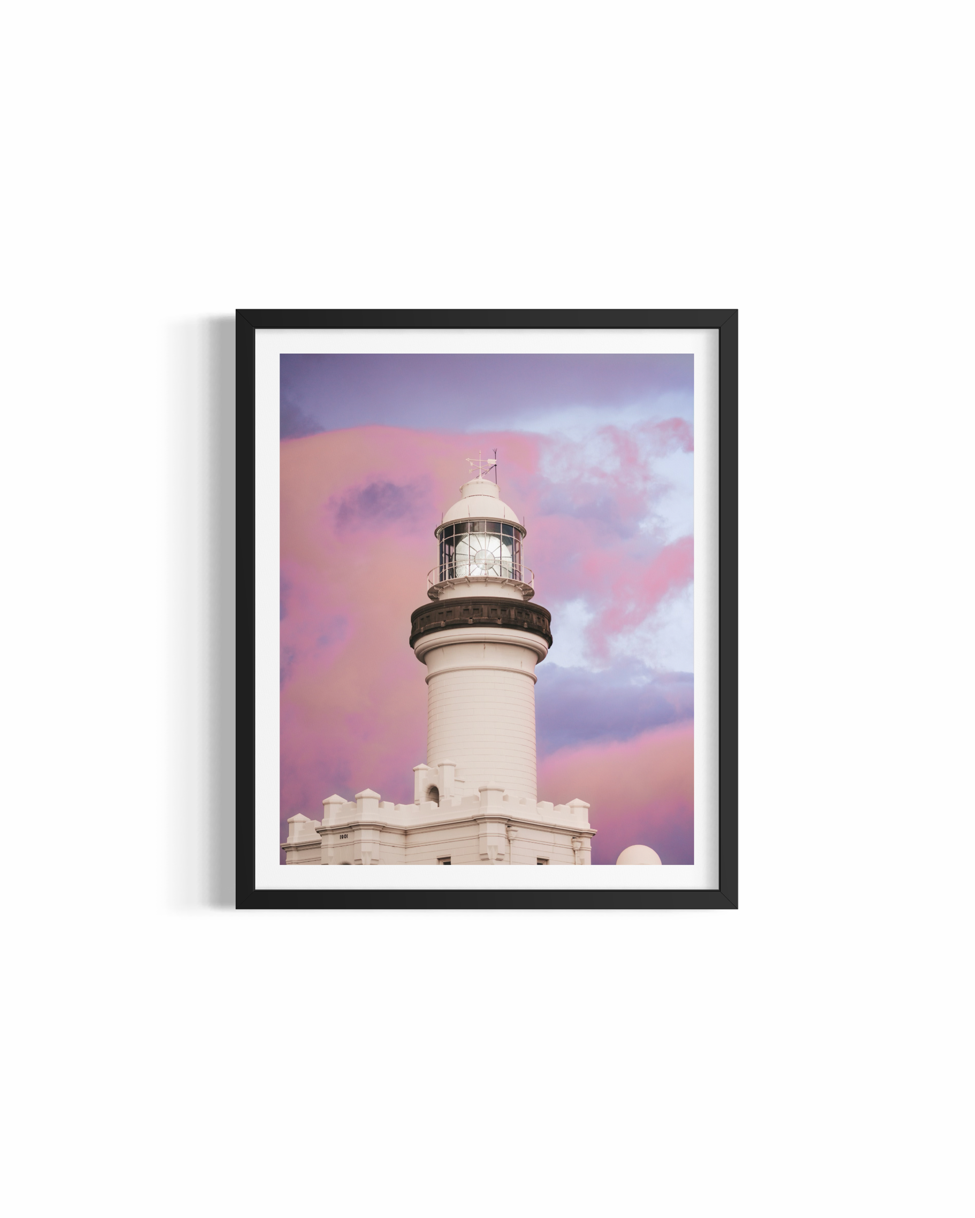 Cape Byron Lighthouse glowing in golden light at sunset on Australia's most easterly point — Byron Bay Lighthouse by Saxon Kent